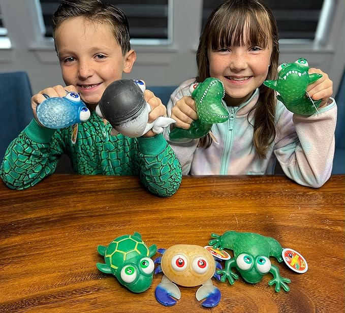 WARM FUZZY Toys (1) Floating Eye Animal Squishy Dinosaur | Funny Sensory Fidget Great for Party Favor, Prize Box, PTA Carnival or School Fundraisers